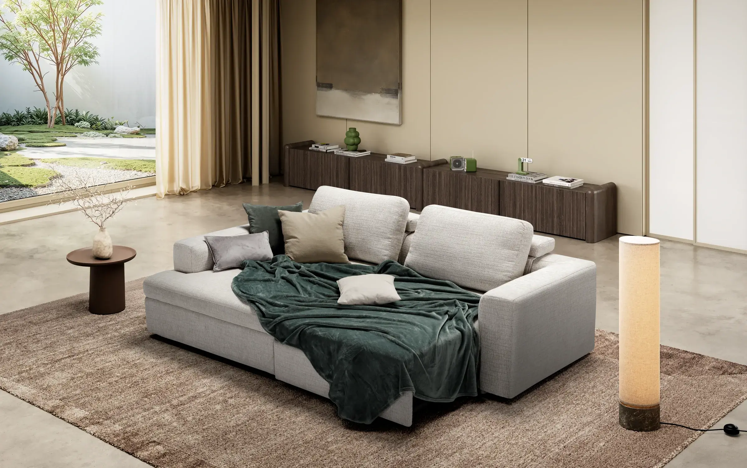 Divano Albert con penisola aperto a letto, con coperta verde, in un living luminoso