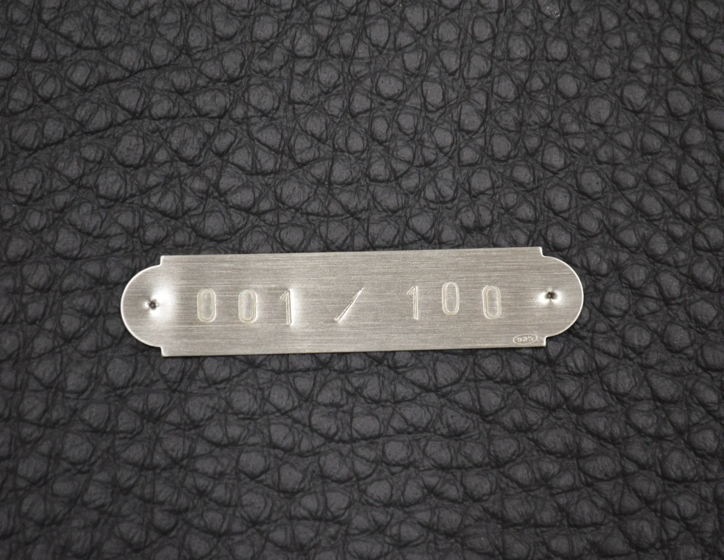 Targhetta numerata 001/100 di Dogma Emerald Edition