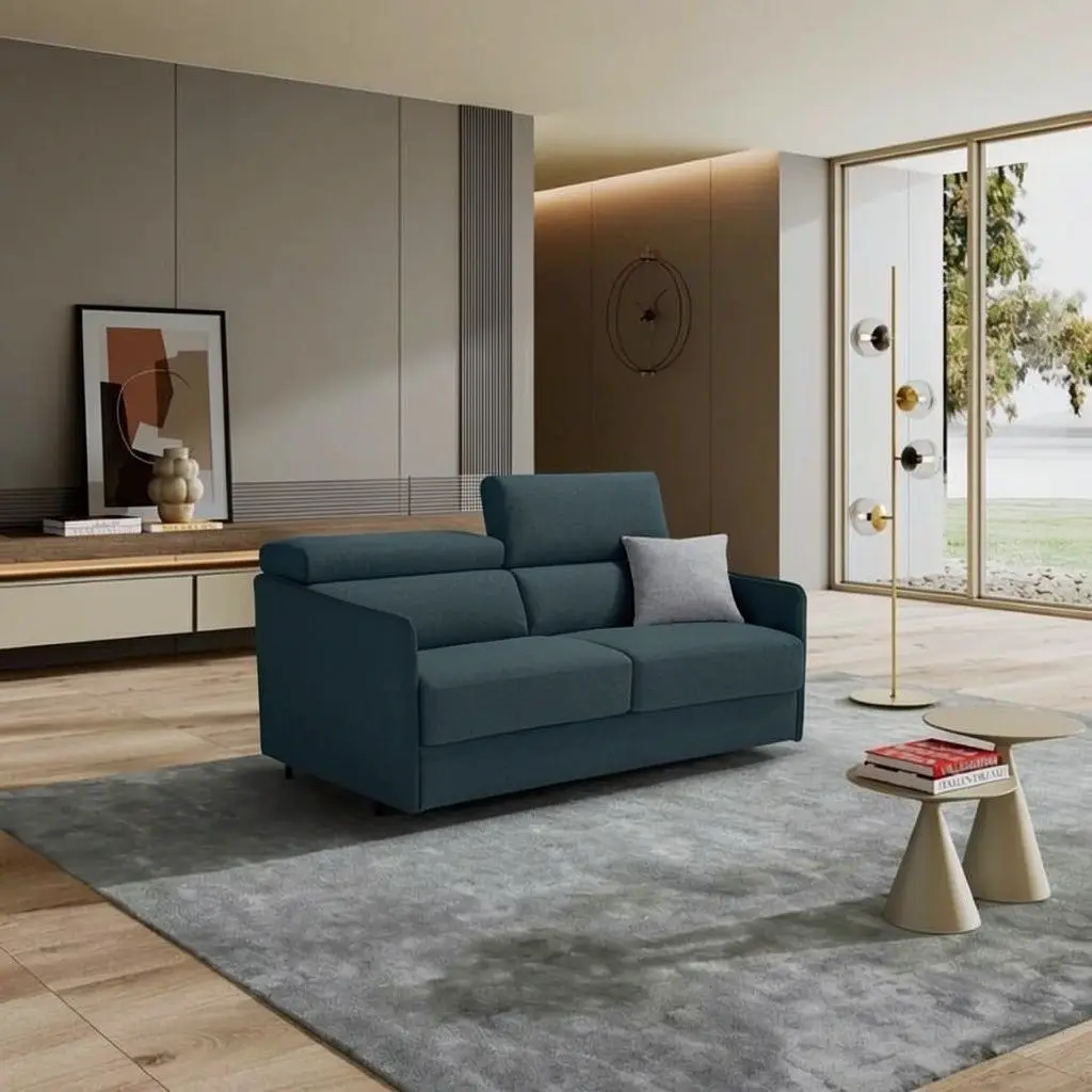 Divano letto Lyra blu petrolio in un living luminoso